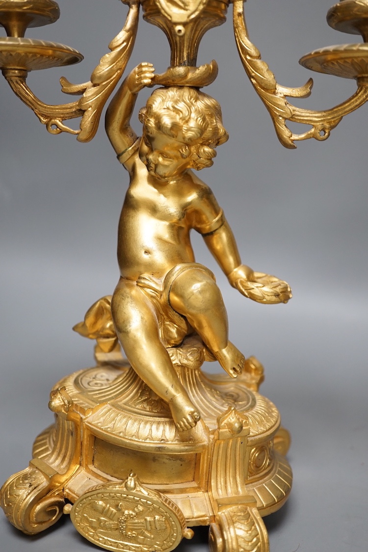 A pair of Louis XVI ormolu cherub candelabra 31cm